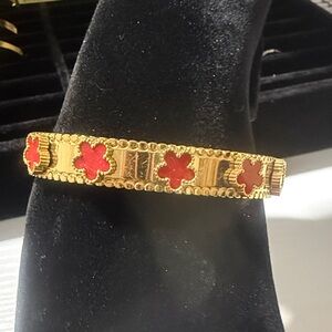 Van Cleef & Arpels Gold Bracelet with Red Clover Accents stainless steel